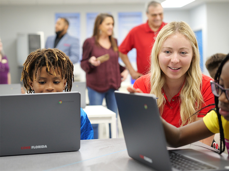 Coke Florida provides access to technology for students with laptops and computer labs.
